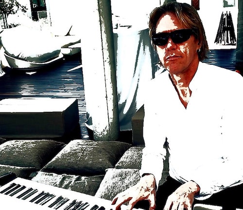 Jens - The Pianoman Marbella behind his playing piano at a Marbella garden party