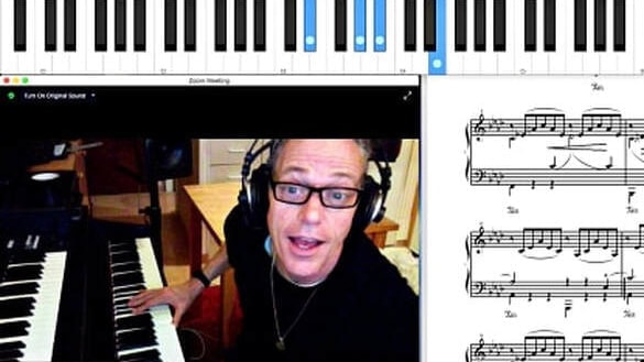 Marbella Music. Online Piano Lessons. Piano teacher on screen mid session.